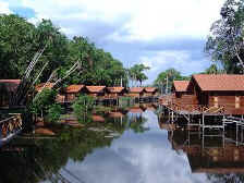 View of the river between the two rows of bungalows on stilts 